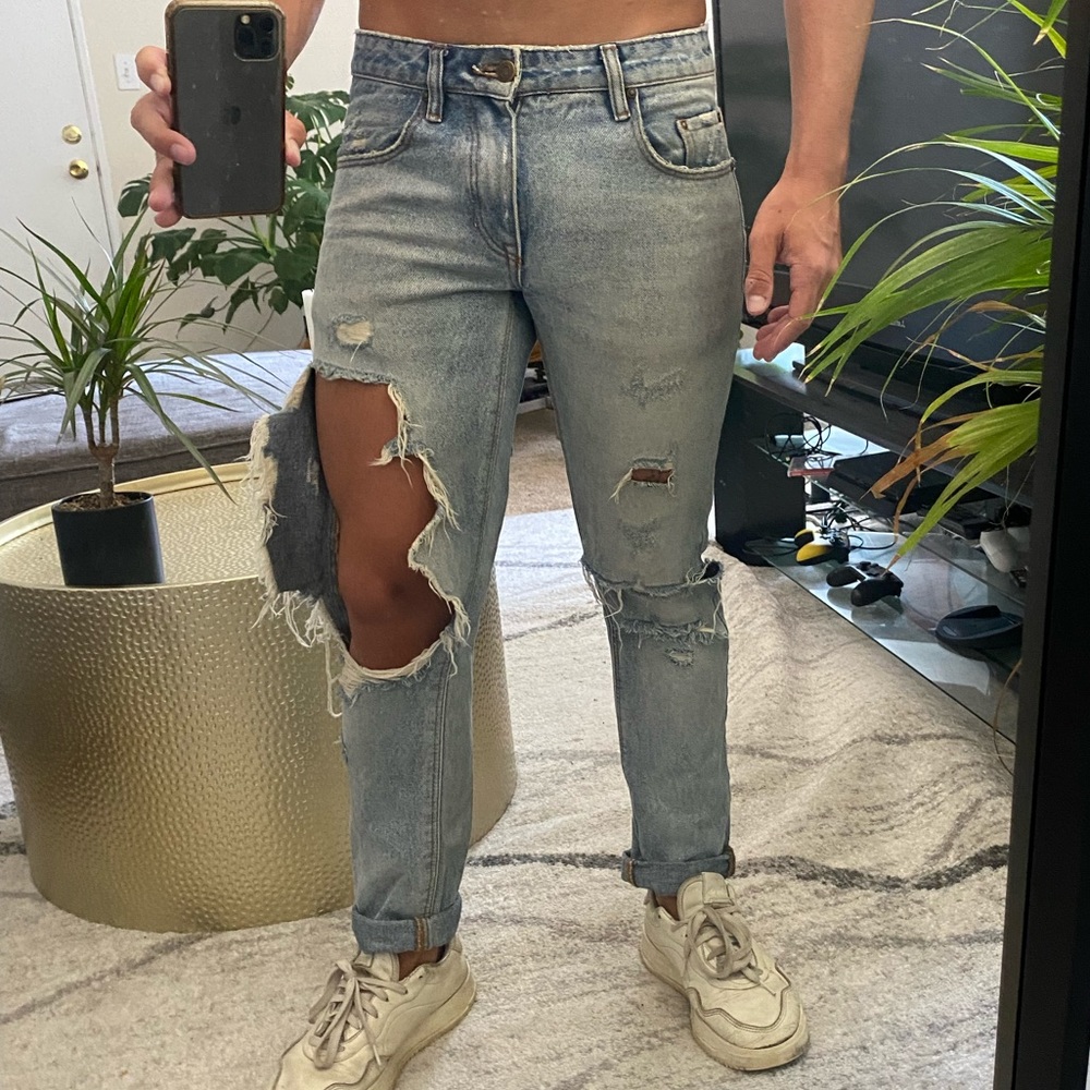 Blown out knee jeans